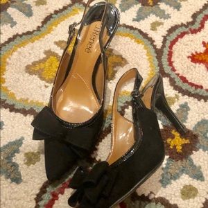 Black suede slingbacks.